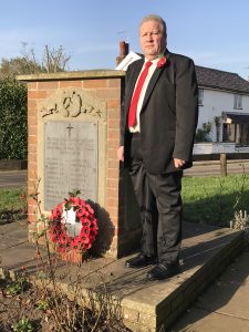 Clive Aylett, Chairman of Wortwell Parish Council, laying wreath on Remembrance Day